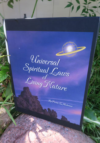 Book called Universal Spiritual Laws of Living Nature by Parisa Z. Ambwani